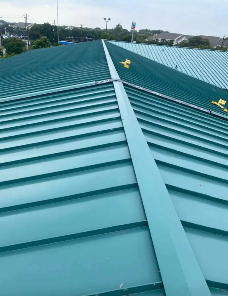 Green commercial metal roof ridge and valley for Metal Roof Repair in Rockport